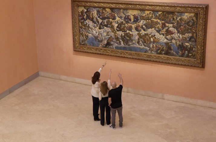 Thyssen-Bornemisza’s art conservator Alejandra Martos with colleagues María Corral and Miguel Peiró ponting at Tintoretto's ‘Paradise’