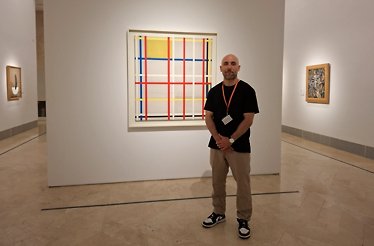 Miguel Peiró standing next to a painting at the Thyssen-Bornemisza museum in Madrid, Spain.