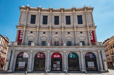 Grand interior of Teatro Real with lavish red seating and ornate balconies