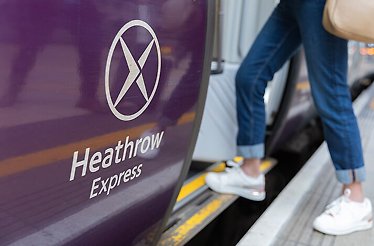 A person entering Heathrow express train