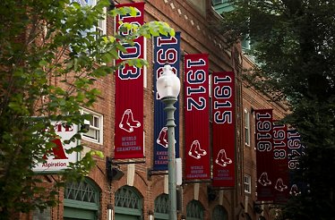 The historic World Series championship banners hanging outside Fenway Park.
