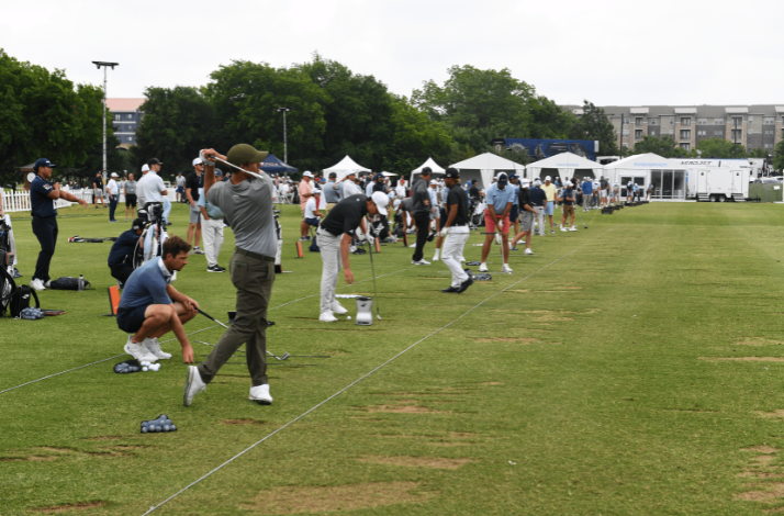 Golfers practicing on the driving range at TPC Craig Ranch during THE CJ CUP Byron Nelson.