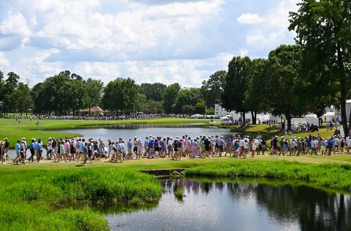 Crowds of people scrolling at gold courses near lakes at  TPC Southwind.