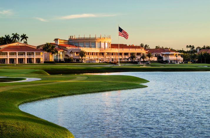 Landmark at Trump National Doral in Miami overlooking the river with US flag hovering over.