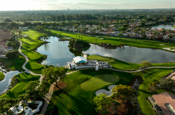Aerial view of a golf course with lakes and surrounding homes