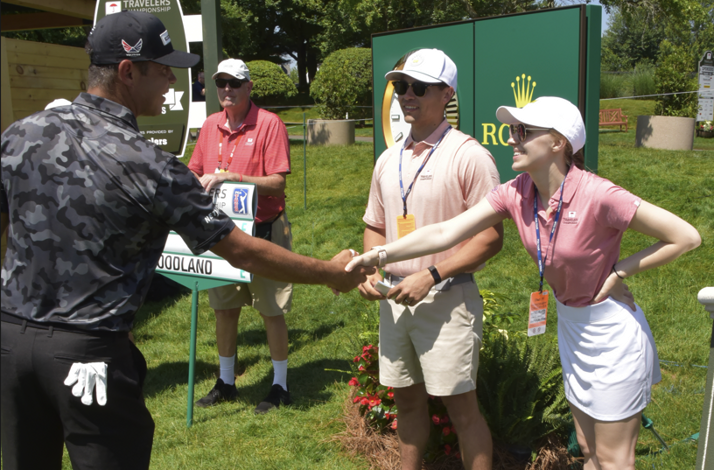 Professional golfer Francesco Molinari shakes hands with staff at the Travelers Championship in Cromwell, CT.