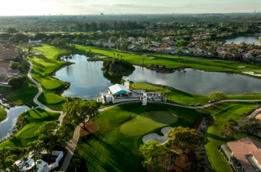 Aerial view of a golf course with lakes and surrounding homes