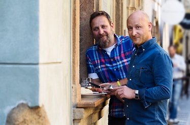 Vladimír Weigert, an expert on the city's food scene and history with one of the customers of an exclusive culinary tour of Old Town Prague.