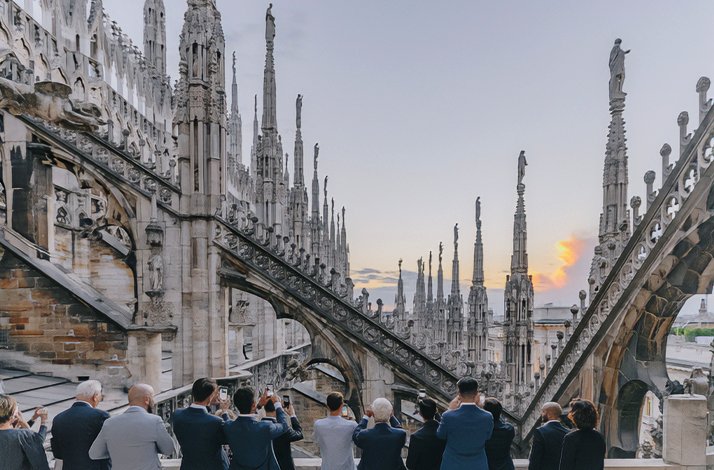 People enjoy the amazing architecture of the Duomo di Milano.
