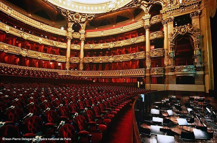 Discover the famous Palais Garnier theater's secrets on a unique tour*: In Paris, France  The Palais Garnier, the famous Opera in Paris designed with dark red curtains and seats. ©Jean-Pierre Delagarde - Opéra national de Paris