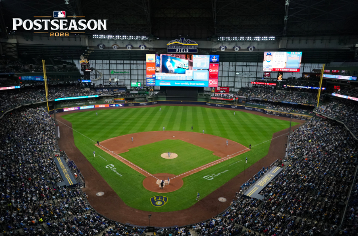 MLB Postseason 2026 game at American Family Field, showing a packed crowd and the Brewers logo near home plate.