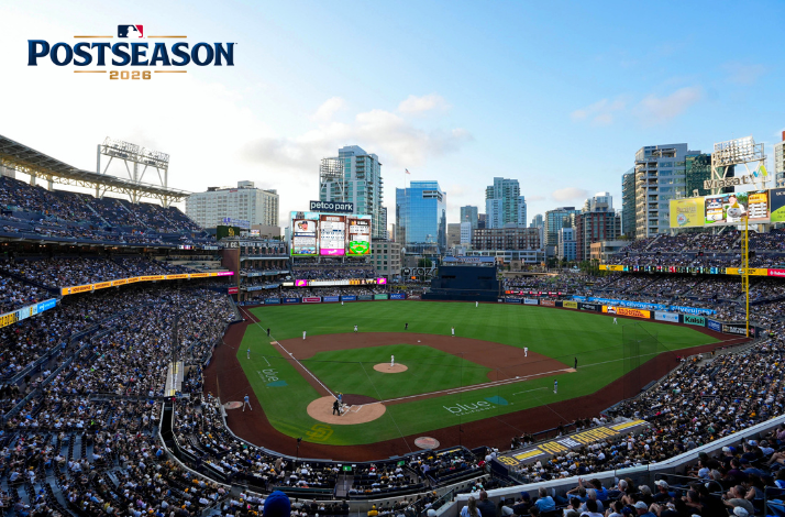 Petco Park filled with Padres fans during MLB Postseason 2026, with San Diego's downtown skyline rising beyond the outfield.