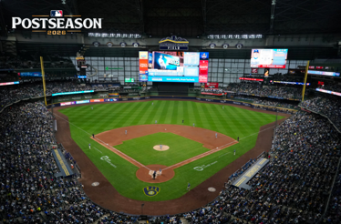 MLB Postseason 2026 game at American Family Field, showing a packed crowd and the Brewers logo near home plate.