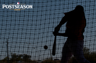 Silhouetted baseball player mid-swing in a batting cage at dusk. MLB Postseason 2026 logo in upper-left corner.