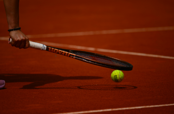 A tennis racket and ball.