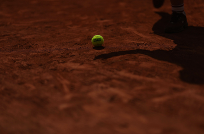Tennis ball with Roland-Garros logo.