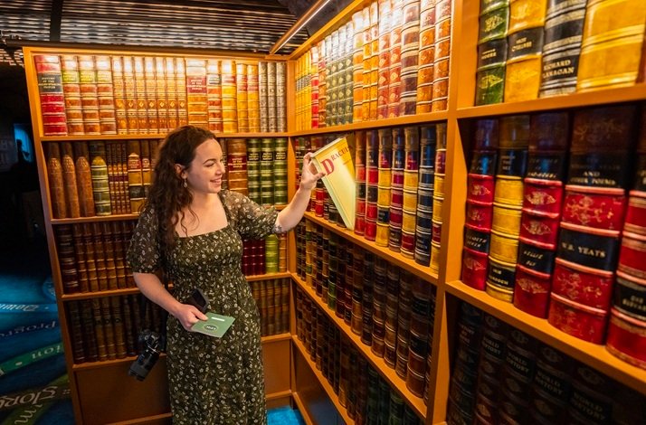 The lady enjoying books at the EPIC museum.