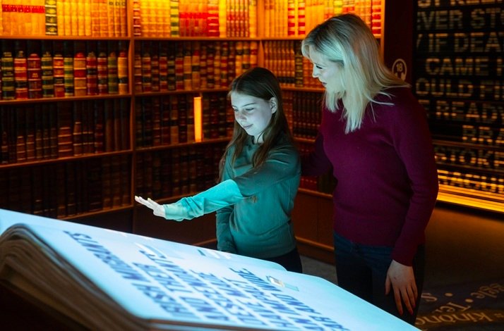 Visitors near the interactive book at at EPIC The Irish Emigration Museum