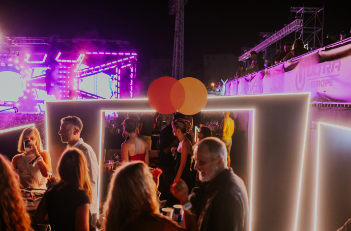 People enjoying music and drinks in the VVIP Mastercard Zone during Ultra Europe 2026 in Split, Croatia.