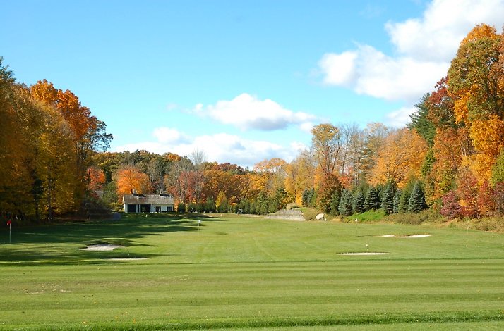 GlenArbor Golf Club field during autumn season on a sunny day.