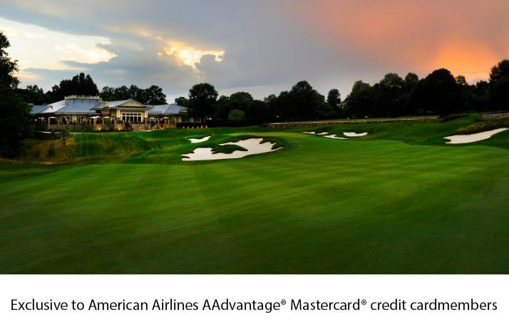 The view of a TPC Potomac golf course with a sunset in the background.