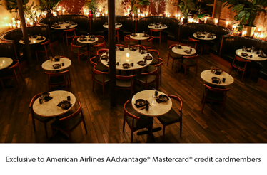 Warmly lit dining room at Chinese Tuxedo featuring intimate tables and historic ambiance, Exclusive for American Airline AAdvantage@ Mastercard@ creditcard members.