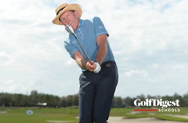 Famous golf instructor David Leadbetter demonstrating a golf swing technique.