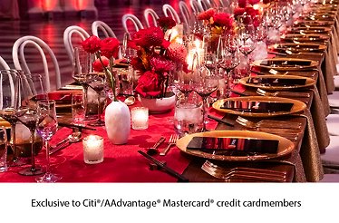 Elegant candlelit banquet table with floral arrangements and fine dining setup  , Exclusive for Citi/AAdvantage@ Mastercard@ creditcard members.