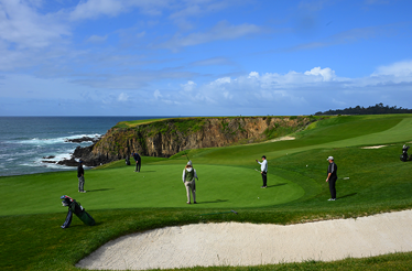 A group of people playing golf at Pebble Beach Resort.