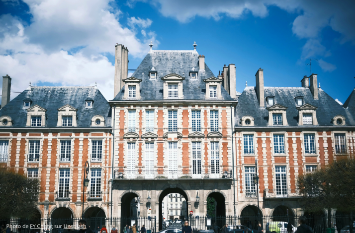 The architectural grandeur of Place des Vosges in the historic Le Marais district. Photo by FY Chang on Unsplash.
