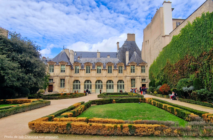 The architectural grandeur of Hôtel de Sully in the historic Le Marais district, with manicured gardens. Photo by Is@ Chessyca on Unsplash.