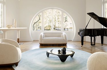 designer Franck Genser's private apartment, with a stained-glass window, interior is in white color with black piano.