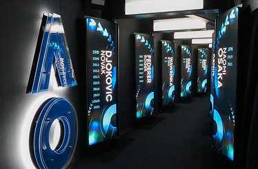Hallway showcasing champion displays at Rod Laver Arena, Australian Open.