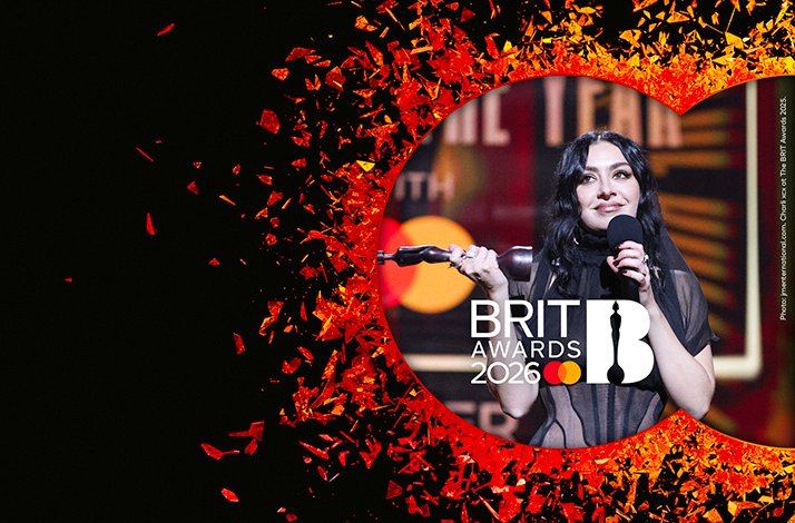 Banner of BRIT awards with a performer on stage.