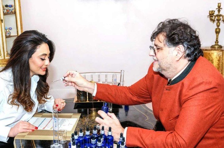 A participant smelling perfume at Le Studio des Parfums.