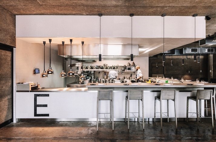 A view of chefs cooking in the kitchen at The Eatery.