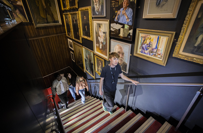 Staircase inside Abbey Theatre with portrait collection on the wall.