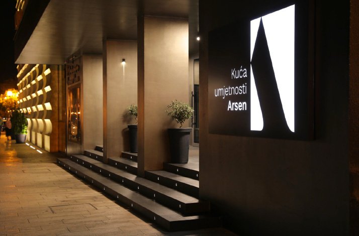 Outside of House of Art Arsen in the evening lights.