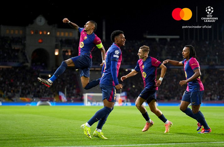 Football players photographed during UEFA Champions League match.