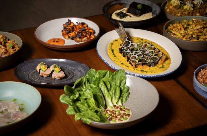 Overhead arrangement of Kayao Chicago tasting menu courses, showcasing contemporary Peruvian dishes with Japanese and Chinese influences.