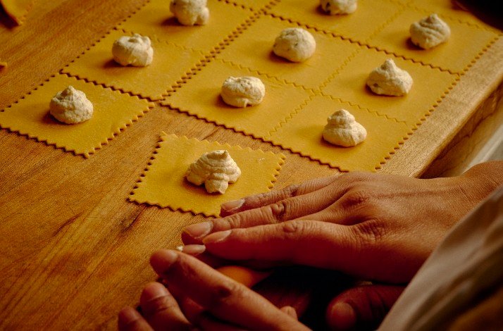 Homemade ravioli preparation with dollops of filling on pasta squares at Antico Nuovo