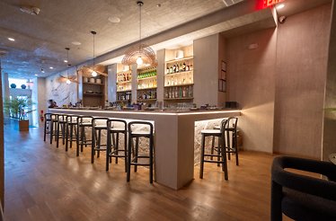 The interior of Matilda in Chicago, showcasing a well-lit drink bar area. 