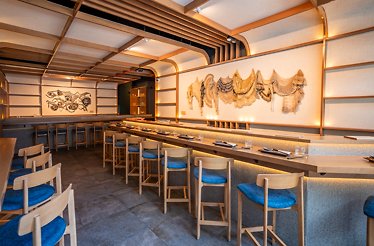 Cozy open-kitchen counter with seats for for a Nikkei-style dinner at Akiro.