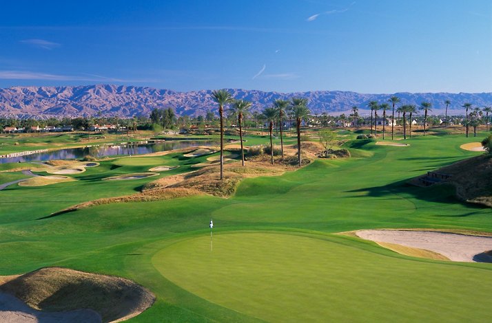 A view of the PGA West Nicklaus Tournament Course in La Quinta, California, featuring its signature water hazards and desert mountain backdrop.