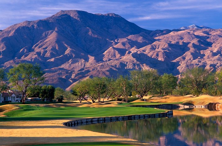 A view of the PGA West Nicklaus Tournament Course in La Quinta, California, featuring its signature water hazards and desert mountain backdrop.