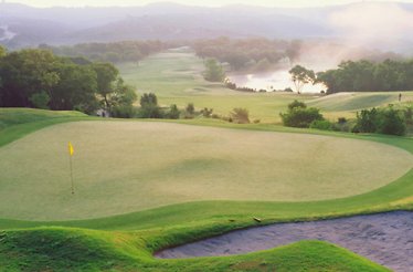 View at the world-class golf courses at Omni Barton Creek Resort & Spa in Austin, Texas in sunrise haze.