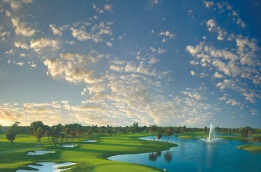 This image shows the 18th hole of the Blue Monster Course at Trump National Doral Miami, famous for its water hazard along the left side.