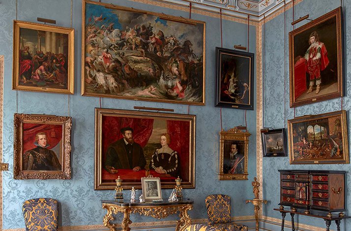 One of the exposition blue rooms at the Palacio de Liria with paintings on display.
