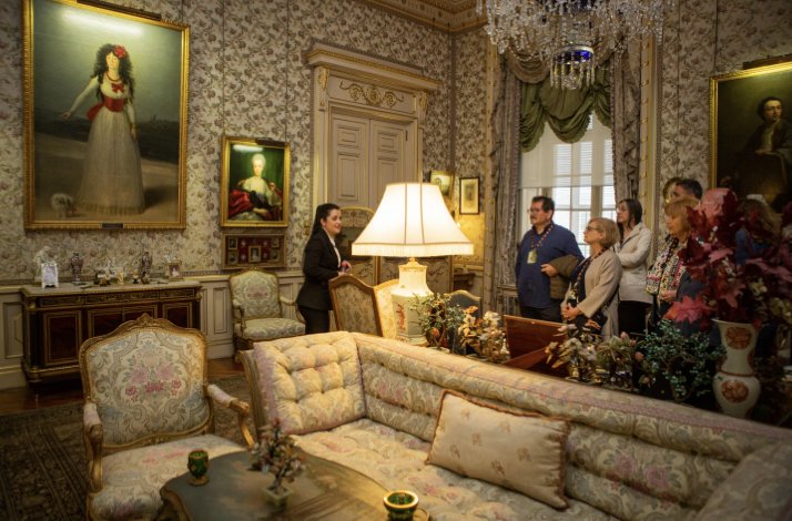 Cozy sitting room featuring ornate decor, classic paintings, and elegant furniture