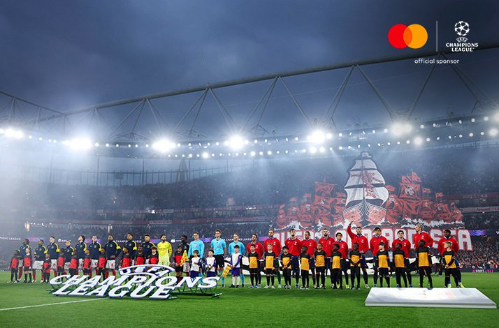 Pre-match lineup of players and UEFA Champions League Player Mascots. Mastercard and UEFA Champions League logos at the top right corner.